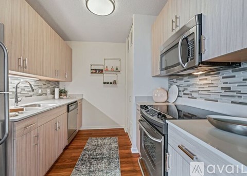 A kitchen with wooden cabinets and a white countertop.