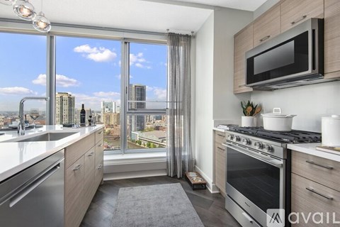 A kitchen with a view of the city.