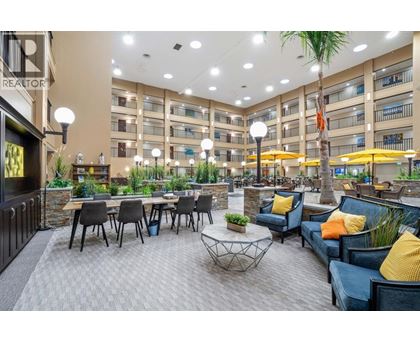 A spacious outdoor seating area with multiple tables and chairs.
