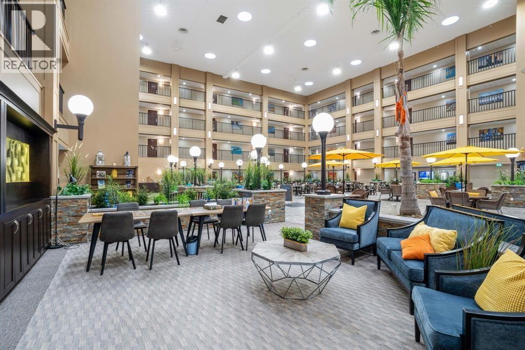 A spacious outdoor seating area with multiple tables and chairs.