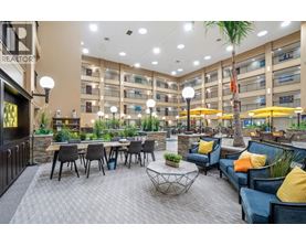 A spacious outdoor seating area with multiple tables and chairs.