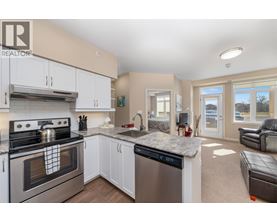 A modern kitchen with a stove top oven and a dishwasher.