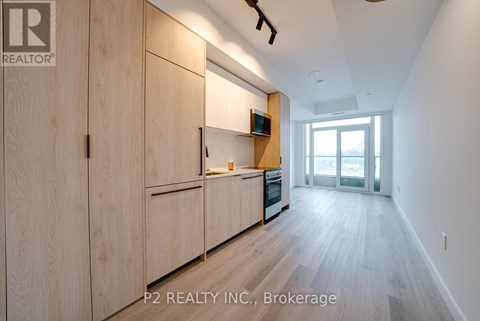 A kitchen with wooden cabinets and a countertop.
