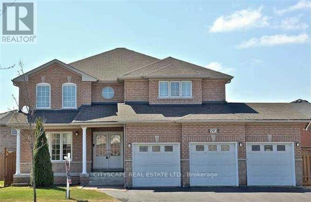 A large brick house with a garage is for sale.