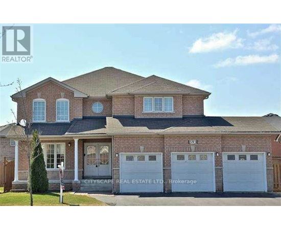 A large brick house with a garage is for sale.