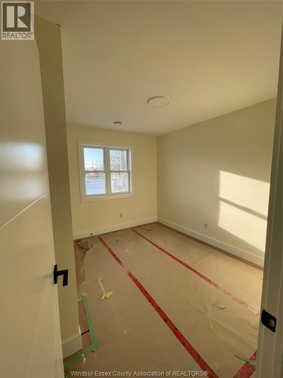 A room with a window and a door is under construction.