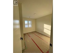 A room with a window and a door is under construction.