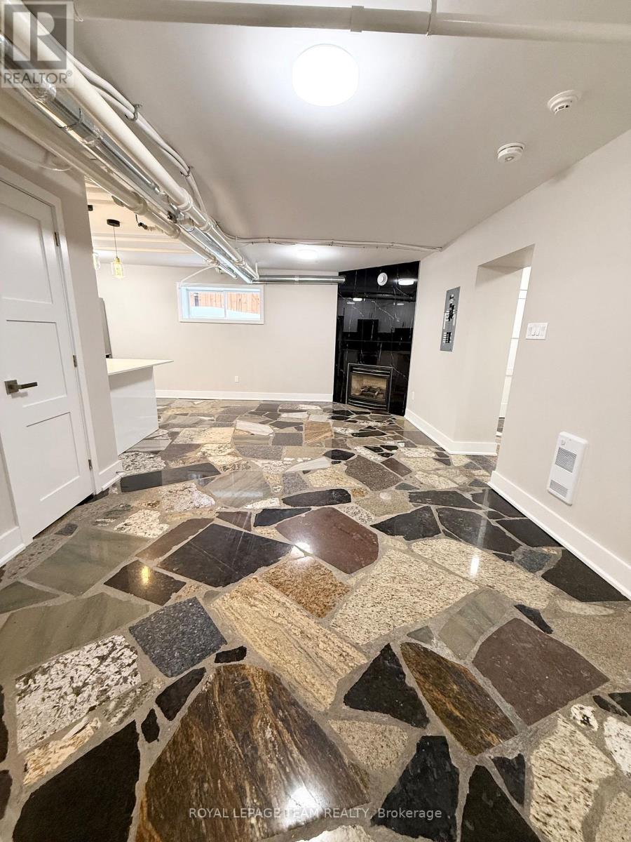 A tile floor with a mix of brown and black tiles.