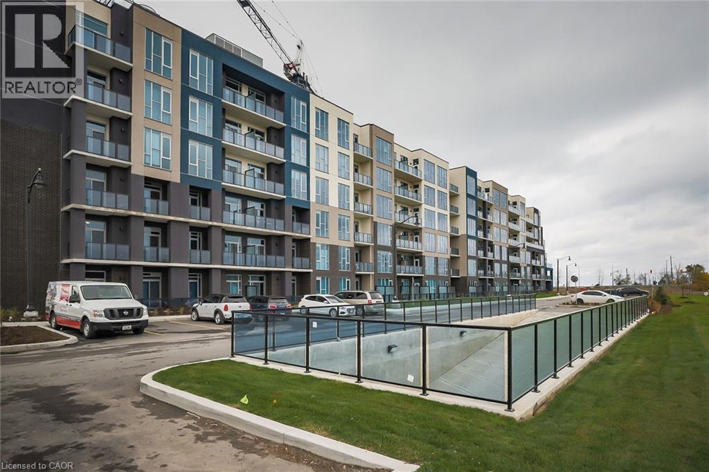 A large building with a glass fence in front of it.