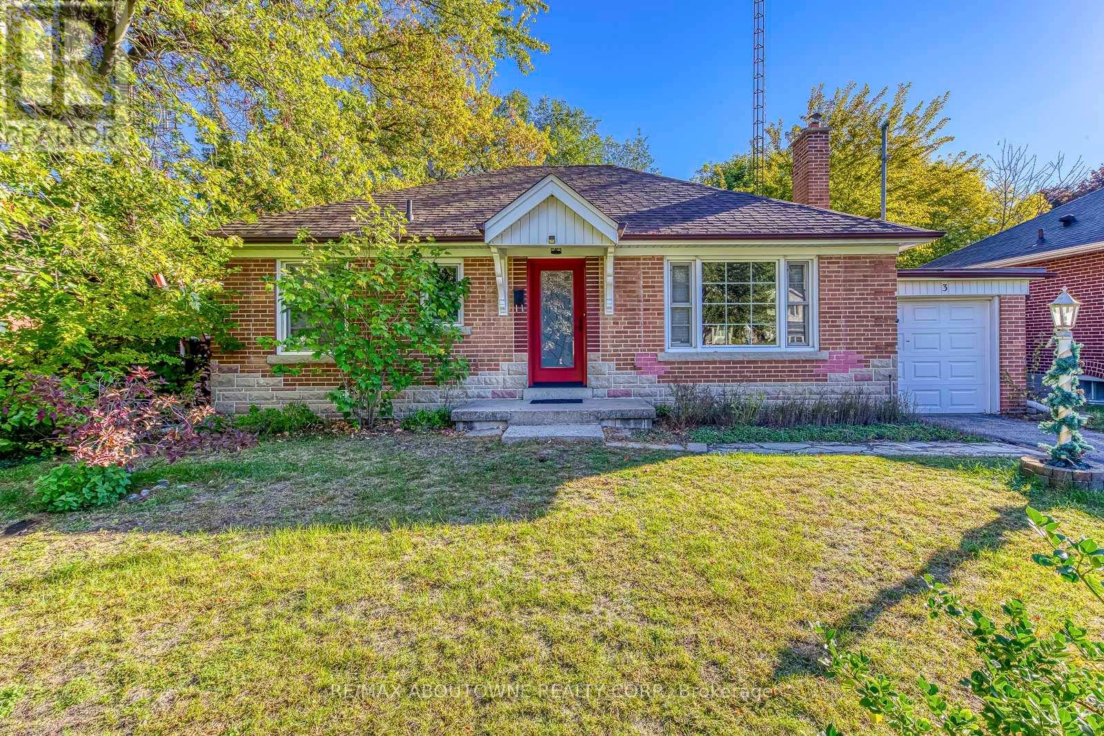 A house with a red door and a white garage door.