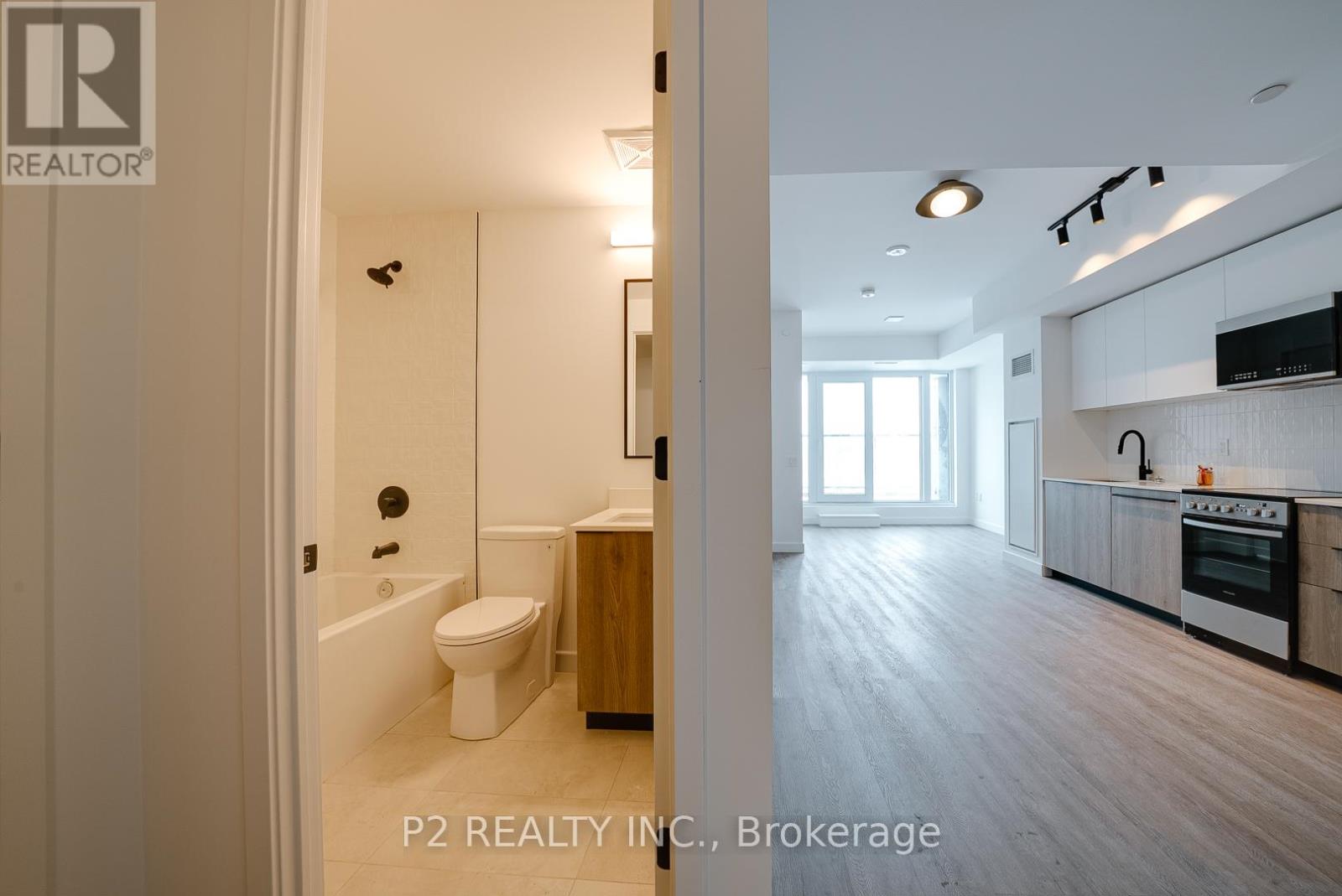 A brokerage image of a modern bathroom and kitchen.