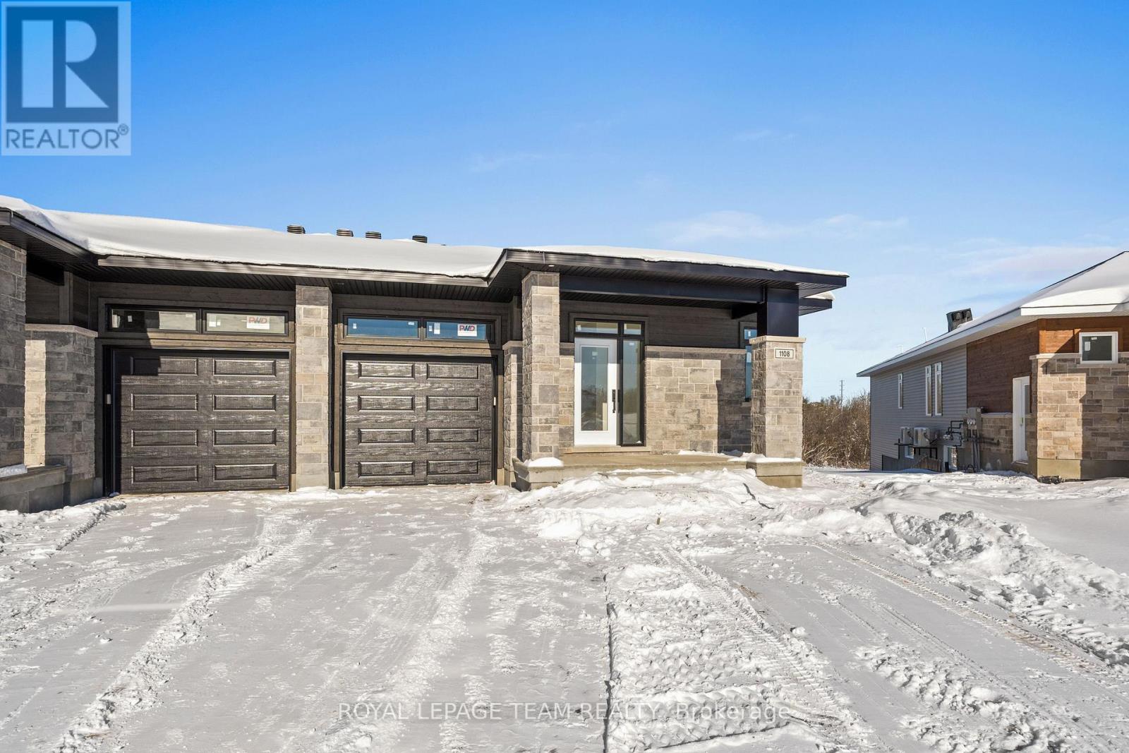A house with a garage and a sign that says "REALTOR" is shown.