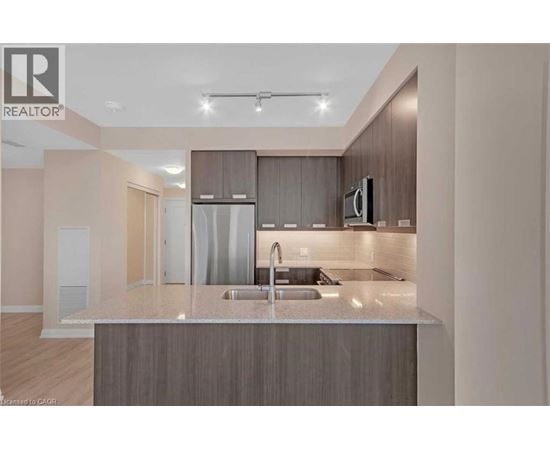 A modern kitchen with a sink and a countertop.