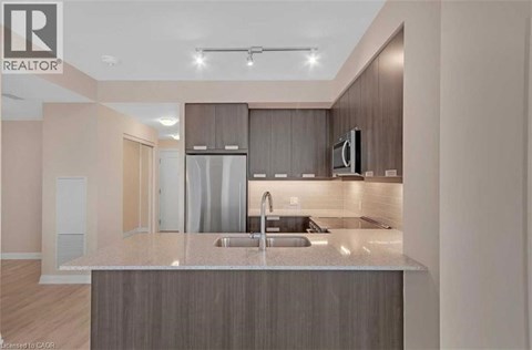 A modern kitchen with a sink and a countertop.