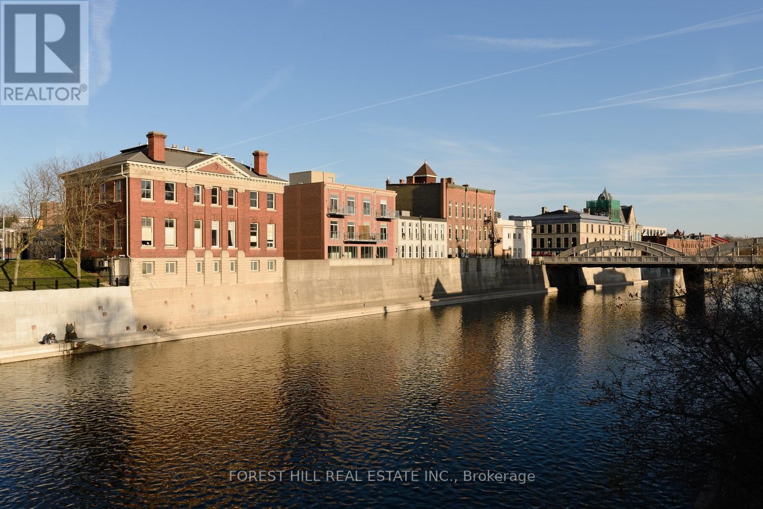 A building with a bridge over a body of water.
