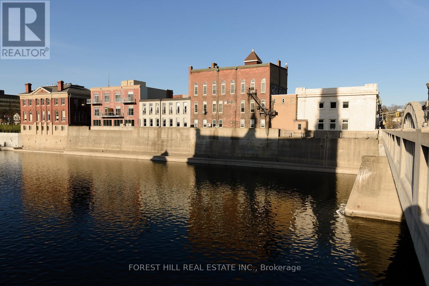 A body of water with buildings on the other side.