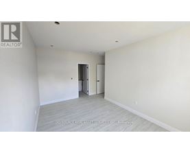 A long hallway with a window at the end.
