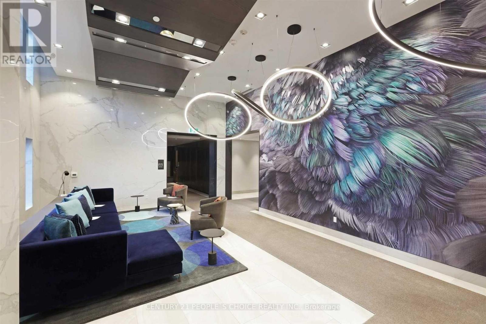 A modern living room with a large mural of a bird on the wall.