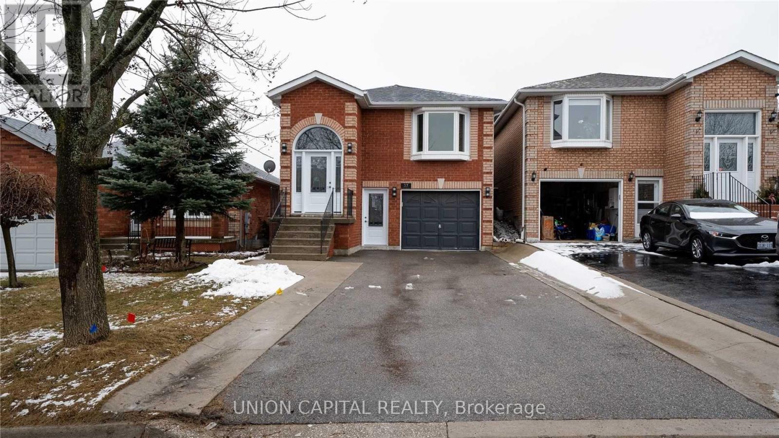 A house with a white garage door is for sale.