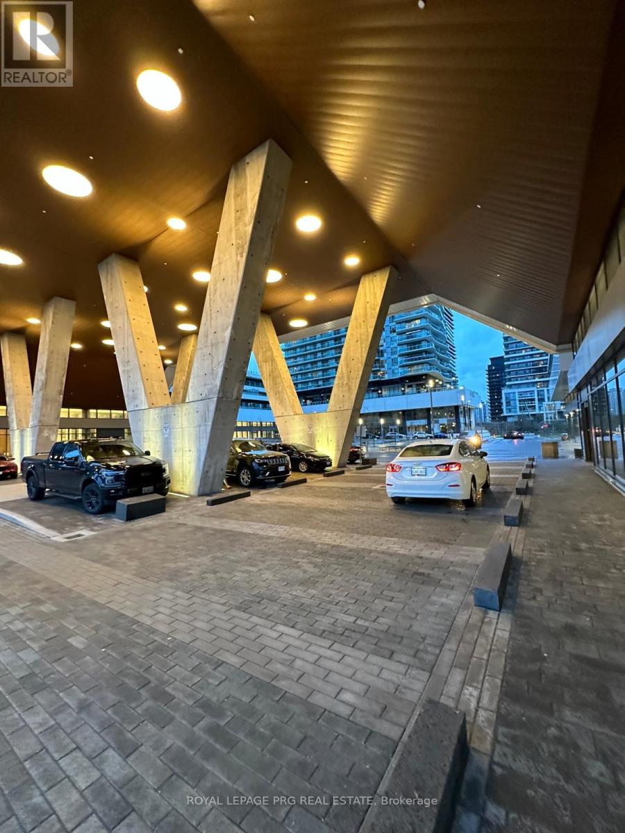 A parking lot with cars and a sign that says "REALTOR".