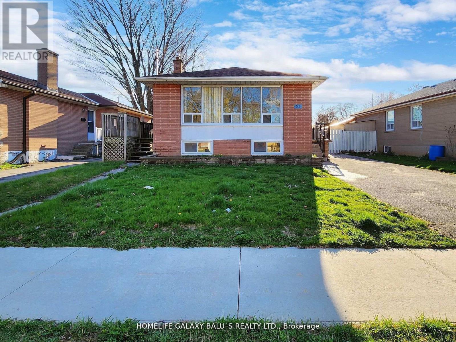 A house with a lawn in front of it is for sale.