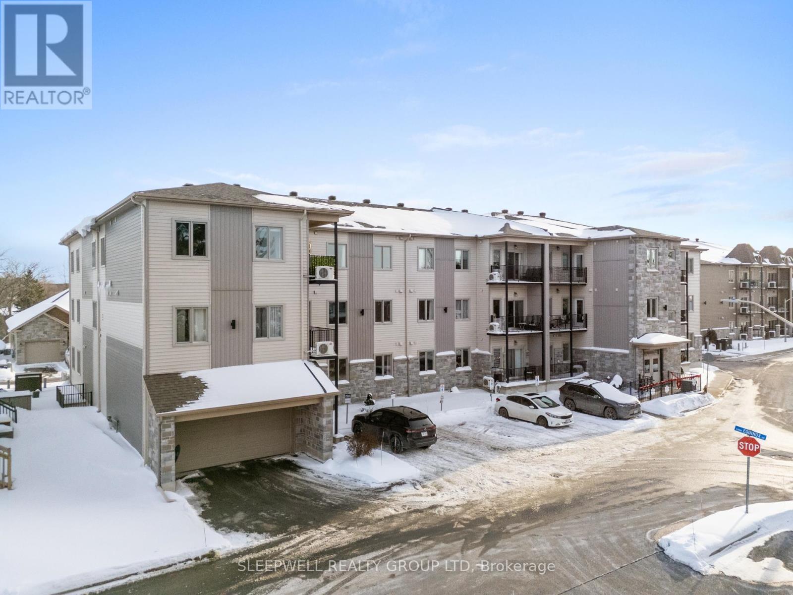 A Sleepwell Realty Group brokerage office is shown in a snowy setting.