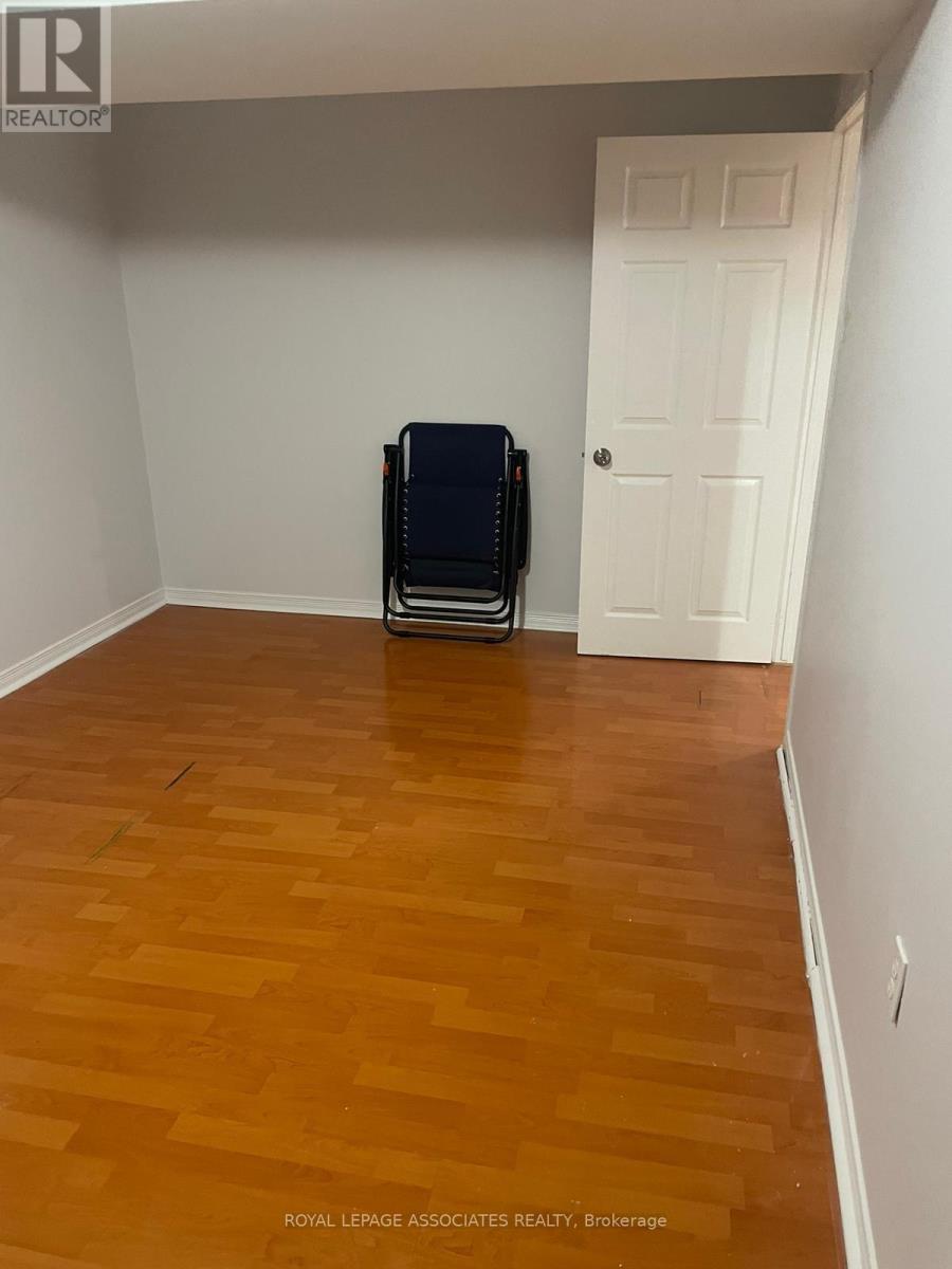 A room with a white door and a black object on the floor.