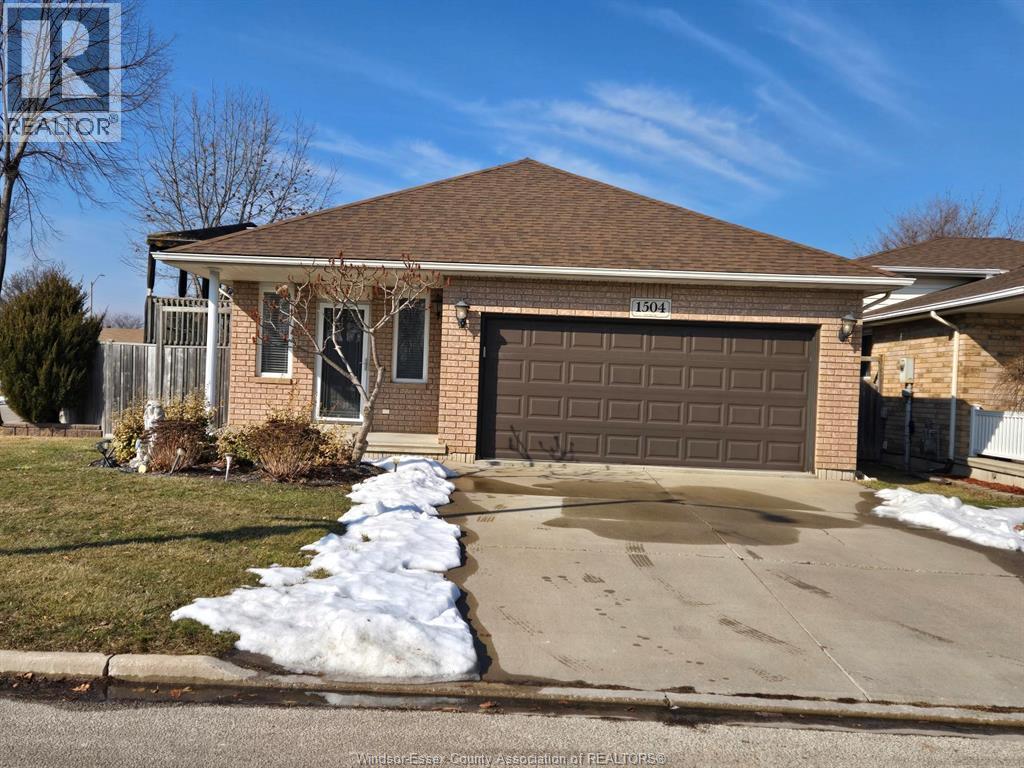 A house with a brown garage door is for sale.