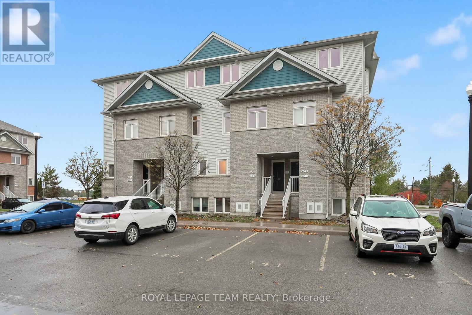 A building with a parking lot in front of it.