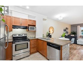 A kitchen with wooden cabinets and stainless steel appliances.