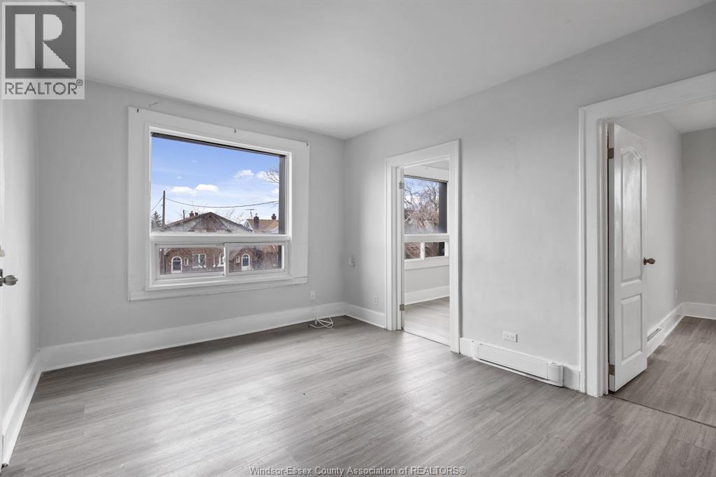 A realtor's office with a large window showing a residential area.