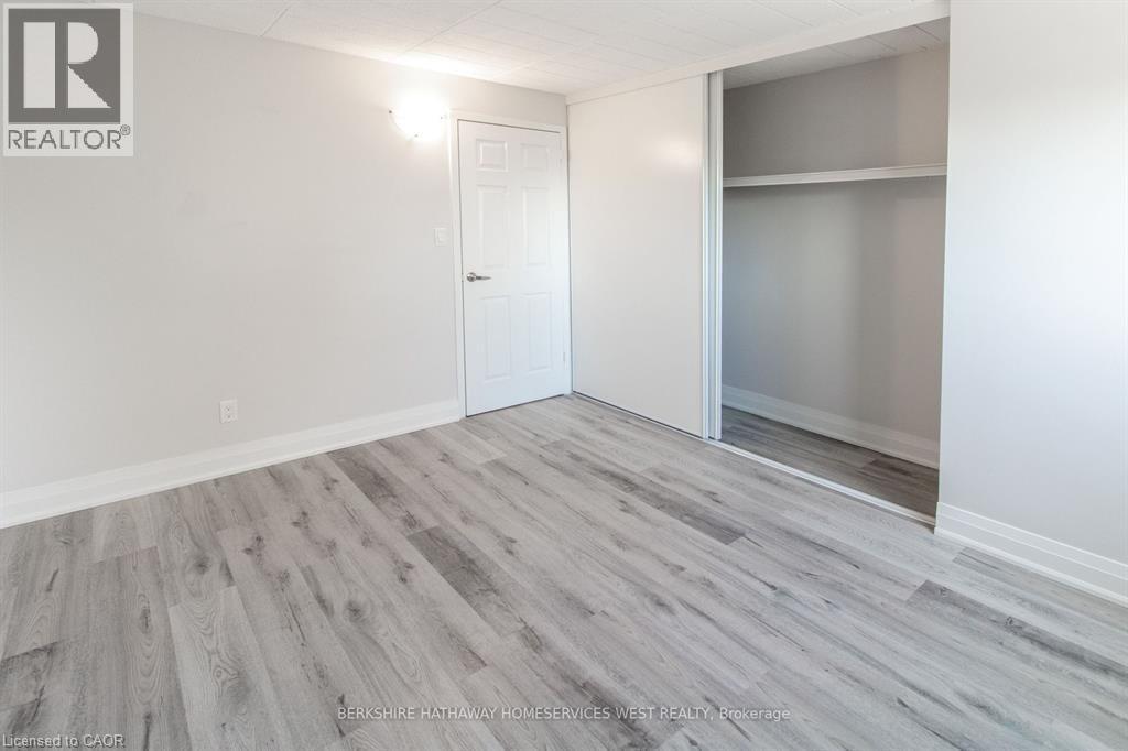 A room with a white door and a glass window.