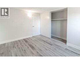 A room with a white door and a glass window.