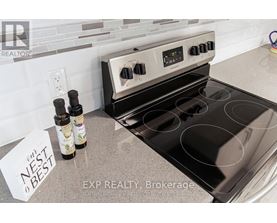 A stove top oven with a note that says nest best on the counter.