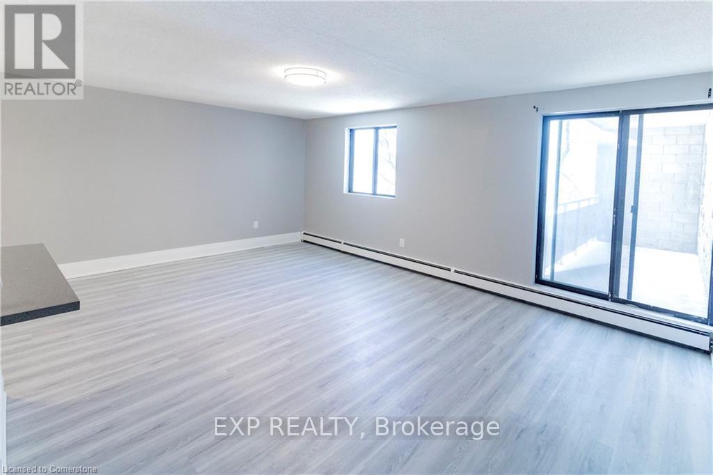 A room with EXP Realty Brokerage logo on the wall.