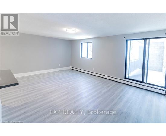 A room with EXP Realty Brokerage logo on the wall.