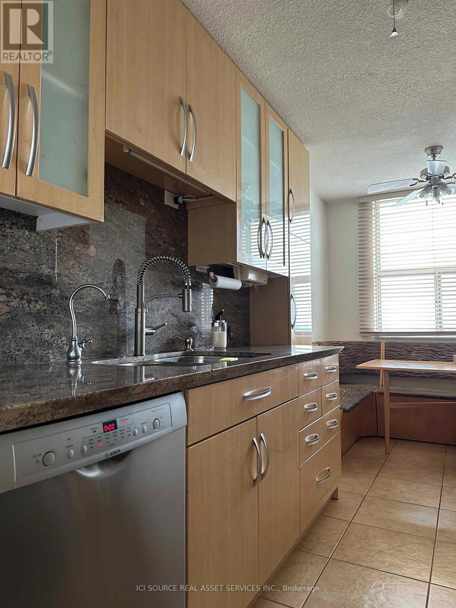 A kitchen with a washer and dryer built in.