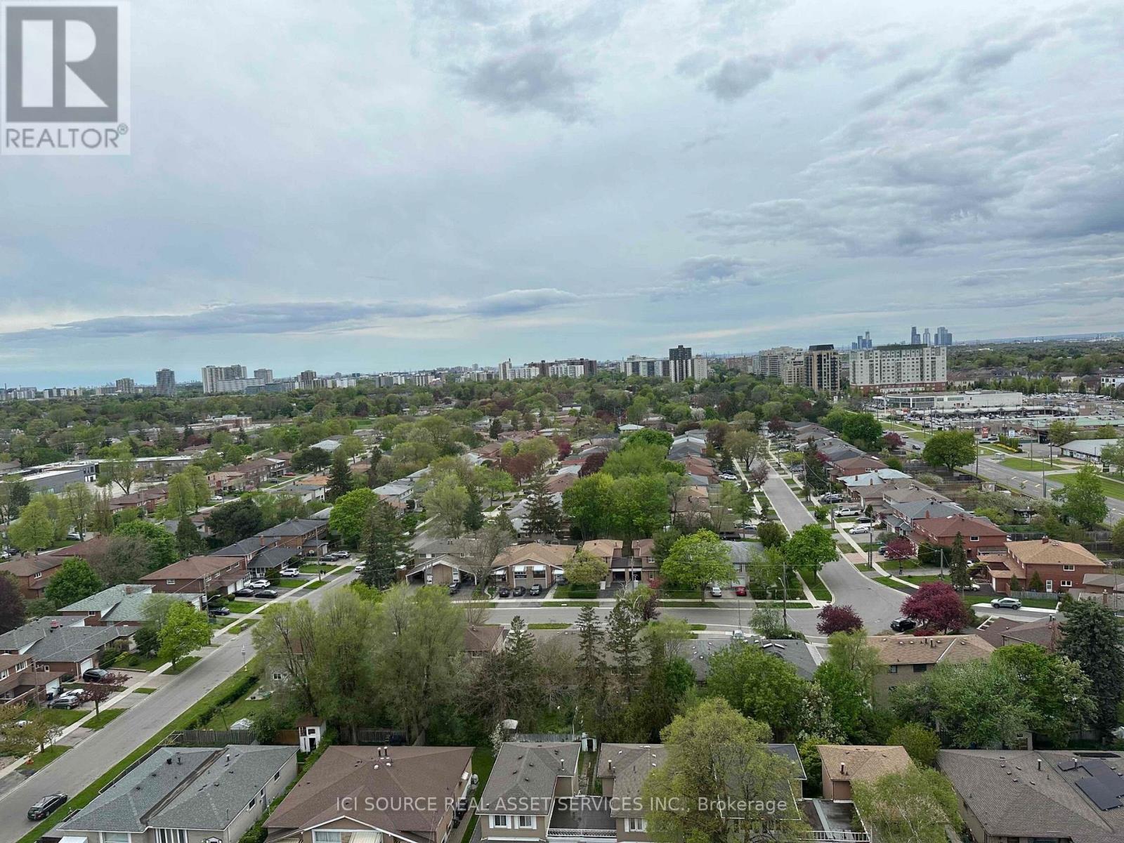 A suburban neighborhood with houses and trees.