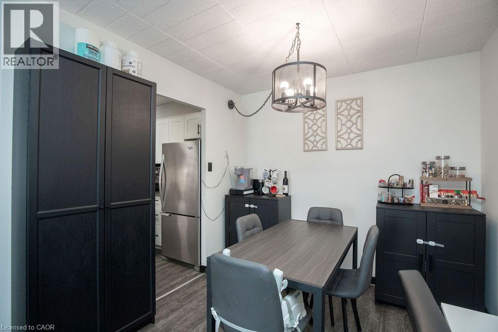 A kitchen with a table and chairs in the middle of the room.