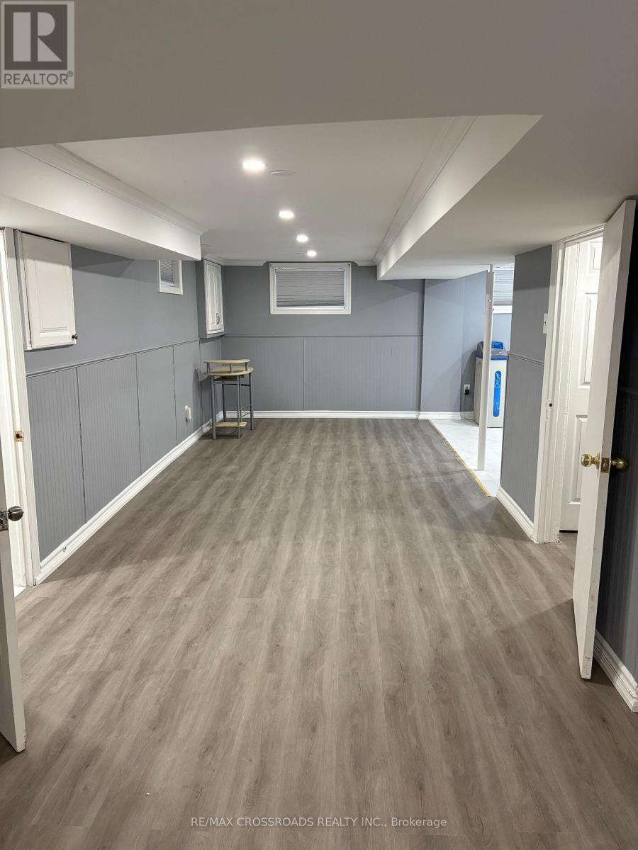 A room with grey walls and wooden flooring.