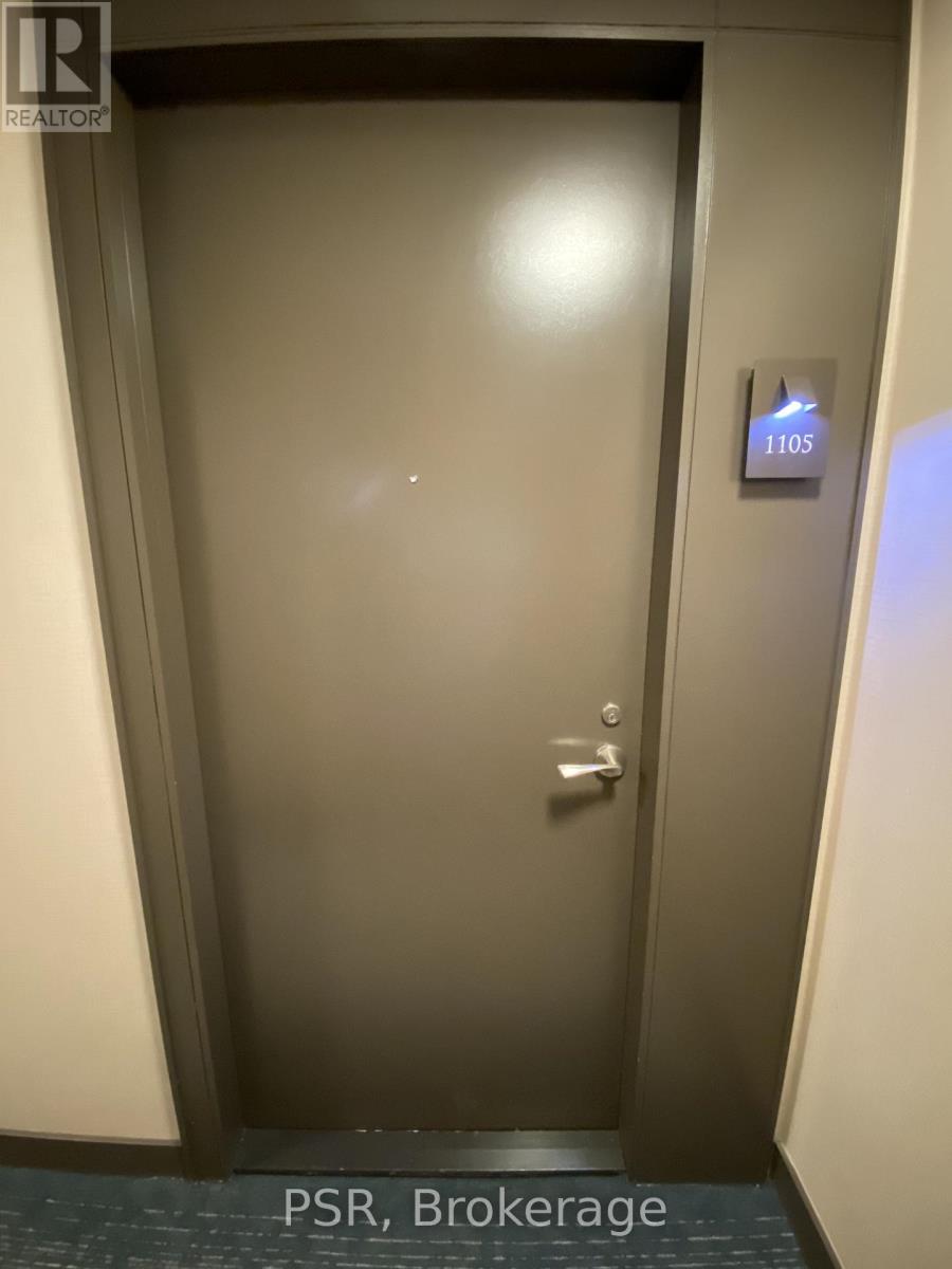 A door with a sign that says 1105 on it.
