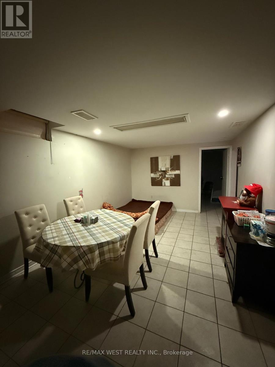 A dining room with a table set for four.