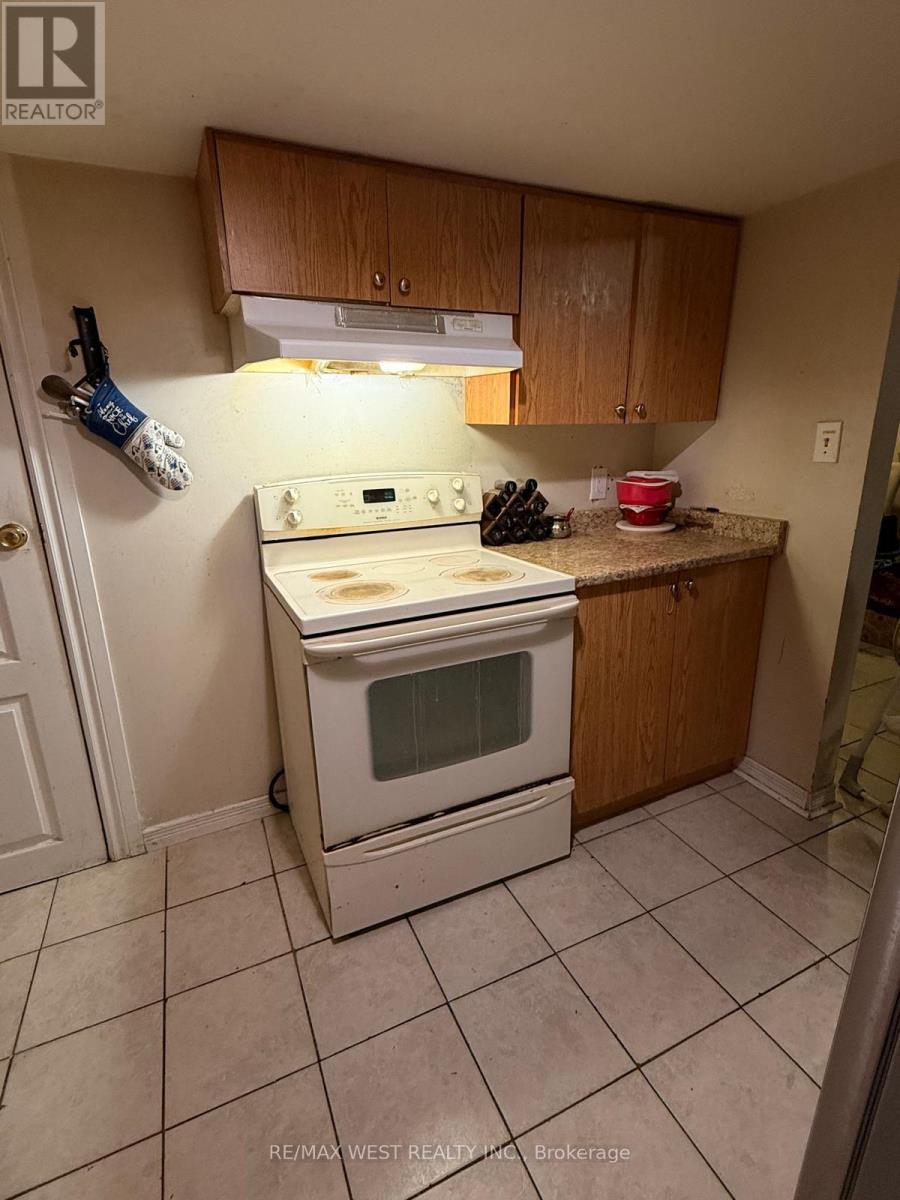 A white oven is built into a kitchen counter.