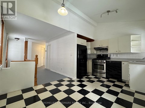 A black and white checkered floor in a kitchen.