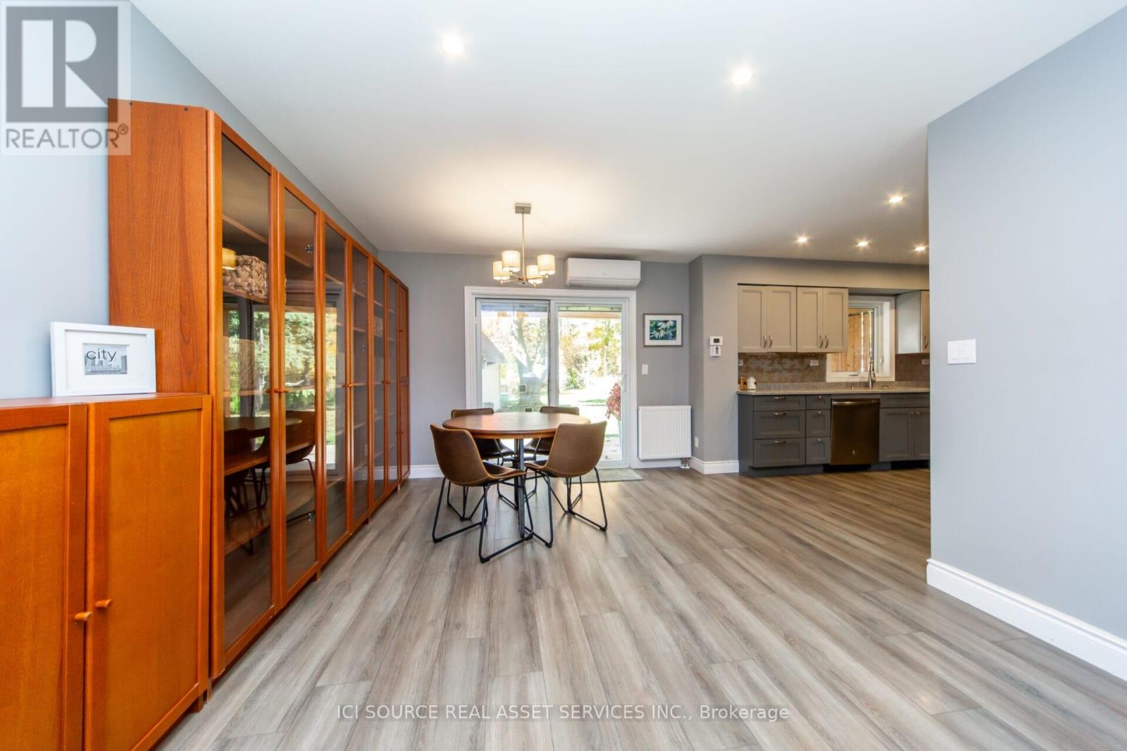 A dining room with a table set for four.