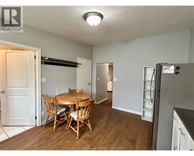 A kitchen with a table and chairs in the middle of the room.
