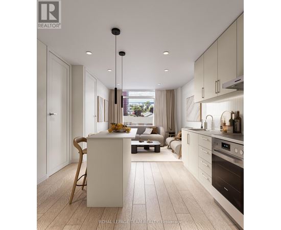 A modern kitchen with a dining table and chairs.