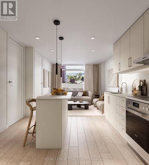 A modern kitchen with a dining table and chairs.