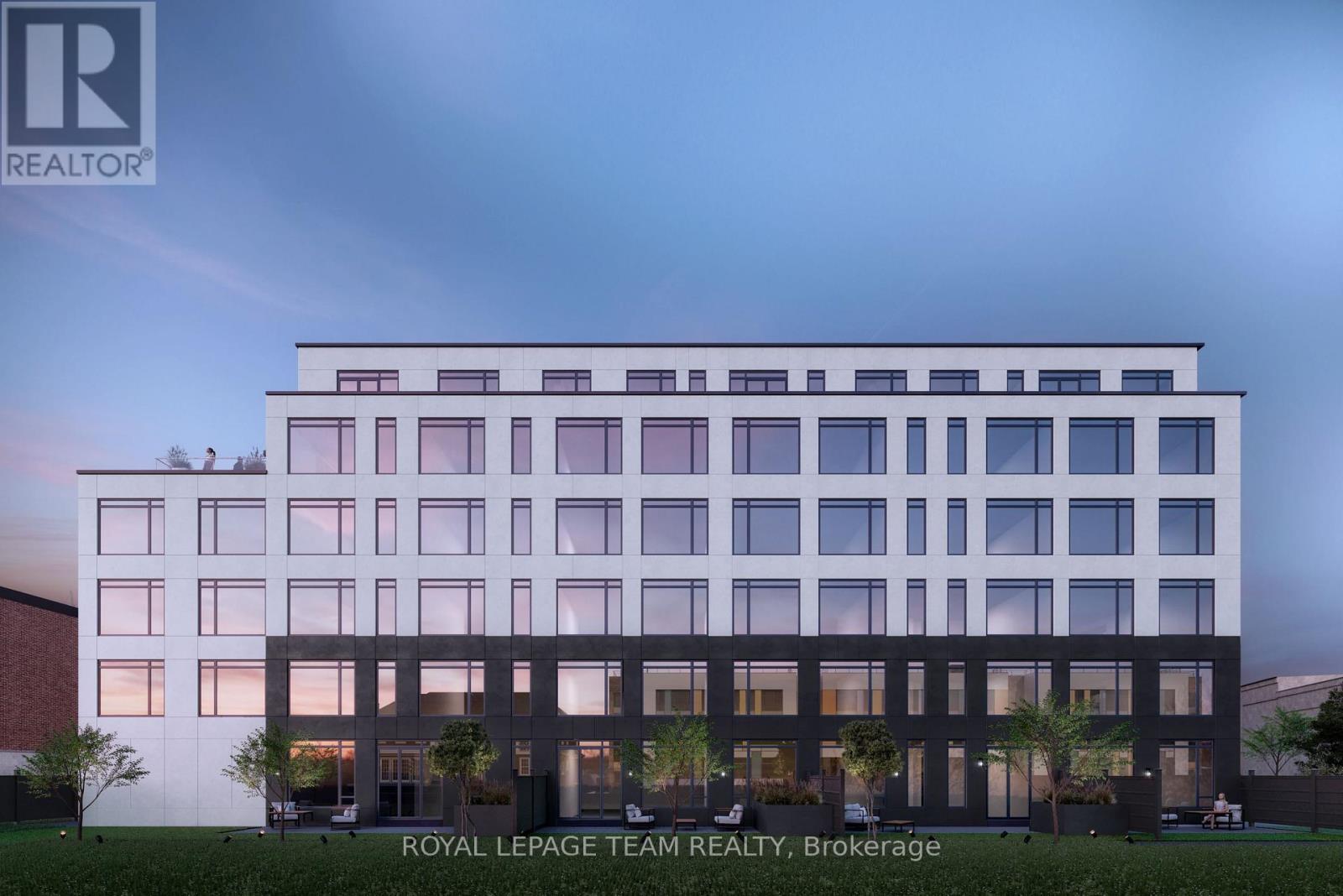 A modern building with the logo of Royal LePage Team Realty, Brokerage on it.