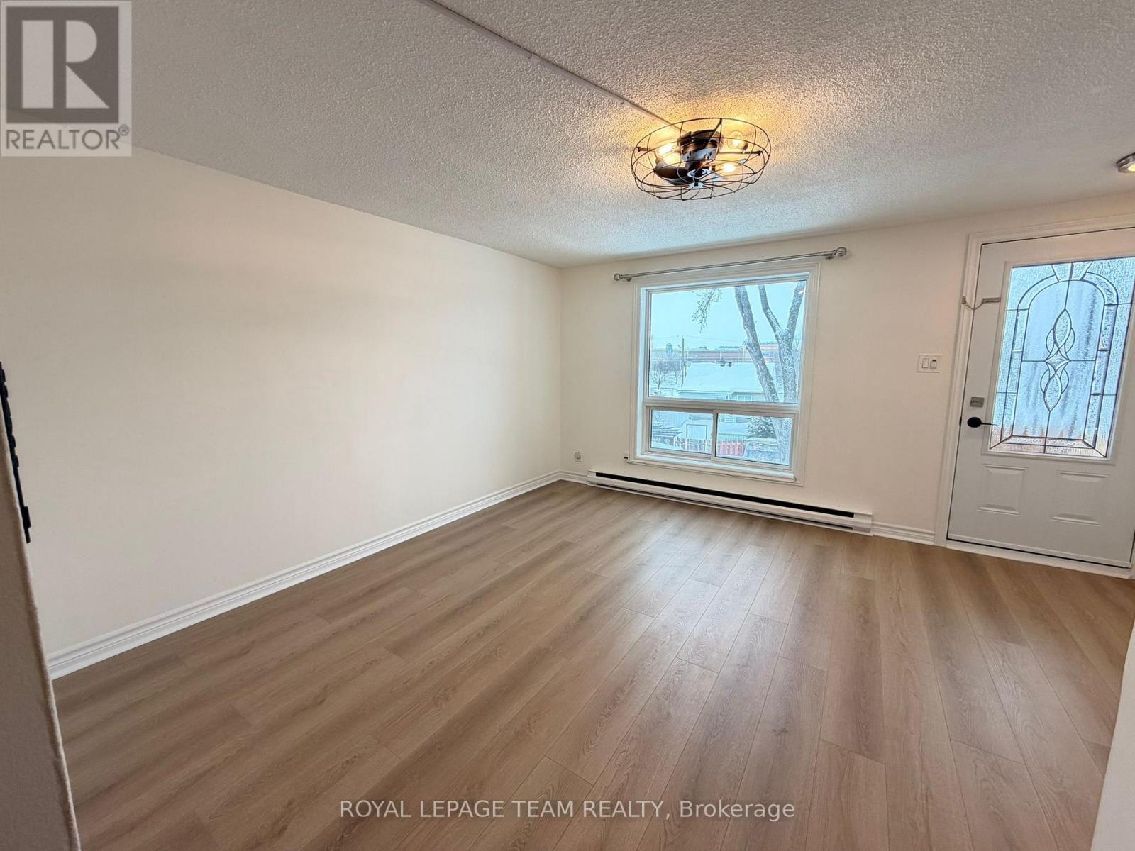 A white door is open to a hallway.